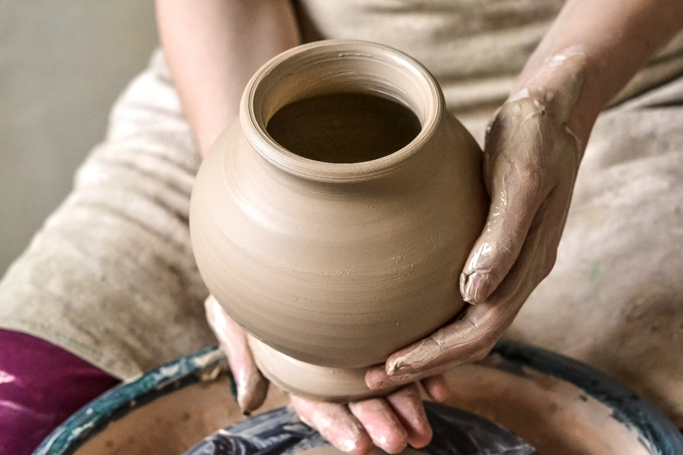 Potter Holding a Clay Vase 